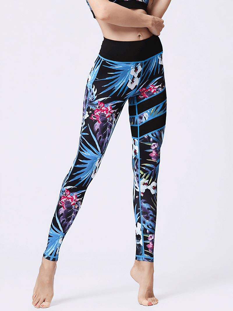 Woman wearing high-waist floral sports leggings, blue and pink flowers, perfect for yoga and fitness, comfortable and breathable.